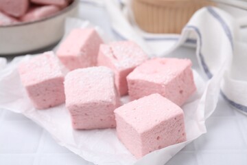 Delicious sweet marshmallows on white table, closeup