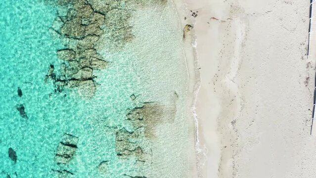 Aerial view of sandy beach and sea with waves - italy, puglia, salento, marina di pulsano