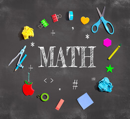 Math theme with school supplies on a chalkboard - flat lay