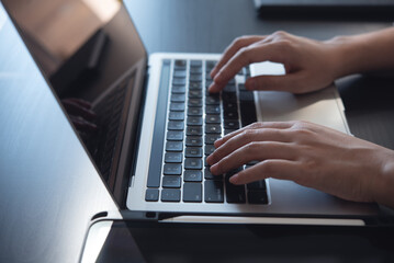 Close up, woman hands typing on laptop computer keyboard, surfing the internet on office table, online, working, business and technology, internet network communication concept