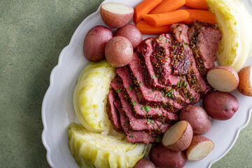 Corned beef with cabbage and potatoes on a serving platter