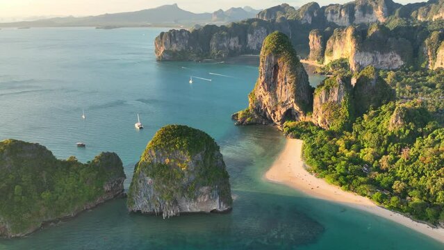 Aerial view of Railay beach at sunset in Thailand, paradise beach in Andaman sea, exotic Thai coastline in Krabi, idyllic Ao nang beach with scenic lagoon in Krabi