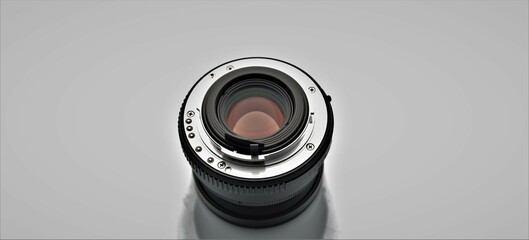 Camera lens on gray background 