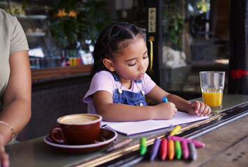 Girl child color in book at cafe, creative and drawing with crayons, family day to relax with...