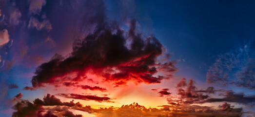 Fototapeta na wymiar amazing stunning colorful sunset, panoramic view of cloudy skies in sunset colors, Bali