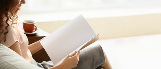 Young woman reading magazine at home. Banner for design