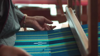 Japanese woman working traditional loom weaving. - Powered by Adobe
