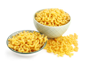 Bowls of uncooked elbow pasta on white background