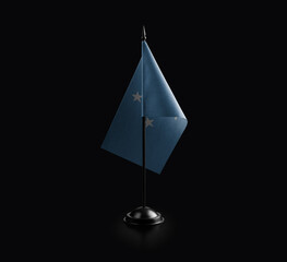 Small national flag of the Federated States Micronesia on a black background