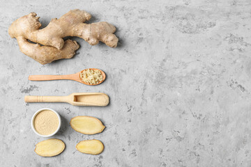 Fresh ginger, slices and powder on grunge background