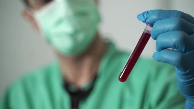 The doctor looked at the results of blood tests from patients in hospitals.