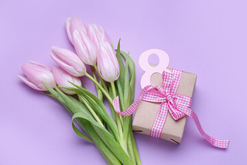 Obraz na płótnie Canvas Bouquet of beautiful tulip flowers and gift for Women's Day celebration on lilac background. Women's Day celebration