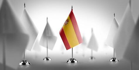 The national flag of the Spain surrounded by white flags