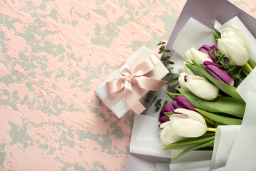 Gift box and bouquet of beautiful tulip flowers on grunge background. Hello spring