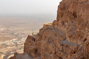 View  during sunrise from the ruins of the fortress wall of the fortress of Masada to the ruins of...