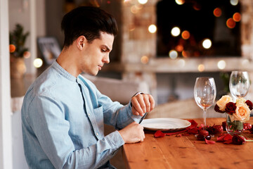Date, watch and man waiting while in the restaurant for valentines day checking the time. Fine dining, late and upset guy by the table for a dinner reservation for anniversary or romantic event.