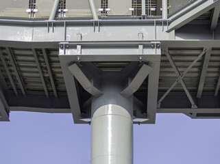 The joint between the large steel columns and the floor of the walkway leading to Electric train station.