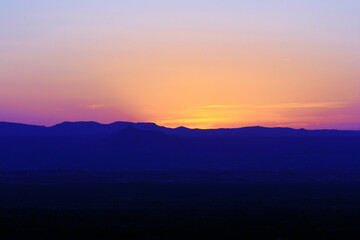 Fototapeta na wymiar new mexico desert sunset with mountains foreground
