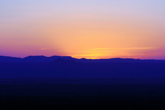 new mexico desert sunset with mountains foreground
