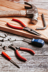 Set of tools on rustic and vintage table for handicraft or construction
