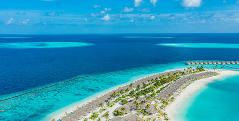 Beautiful Maldives paradise. Tropical aerial travel landscape, seascape with wooden bridge, water villas, amazing sea sand sky beach, tropical island nature. Exotic tourism destination summer vacation
