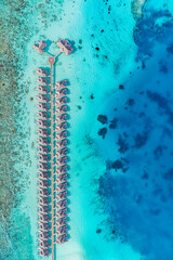 Beautiful Maldives paradise. Tropical aerial travel landscape, seascape with wooden bridge, water villas, amazing sea sand sky beach, tropical island nature. Exotic tourism destination summer vacation