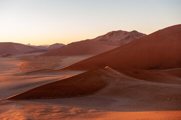 Fototapeta na wymiar Exterior shot of the Namibian Sossusvlei sanddunes near the famous Dune 45 around sunrise