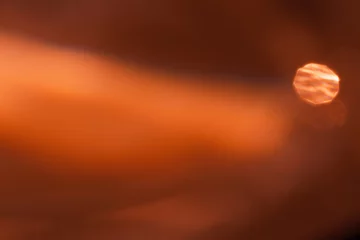 Foto op Plexiglas Donkerrood Abstract photo landscape, sunlight background, glare and shine texture, flare bokeh, red orange blur monochrome minimal sunset scene. Natural light effect, trend aesthetic fon, color gradient