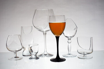 A glass of wine and broken glasses. Stop alcohol symbol.