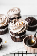 chocolate cake with chocolate muffin cupcake with butter cream and syrup and whipped cream