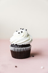 chocolate cake with chocolate muffin cupcake with butter cream and syrup and whipped cream