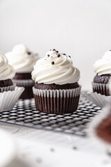 chocolate cake with chocolate muffin cupcake with butter cream and syrup and whipped cream