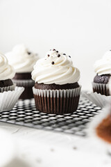 chocolate cake with chocolate muffin cupcake with butter cream and syrup and whipped cream