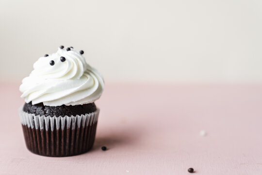 Chocolate Cake With Chocolate Muffin Cupcake With Butter Cream And Syrup And Whipped Cream