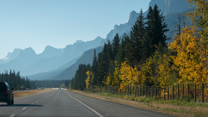 Fototapeta na wymiar Driving on the Trans-Canada Highway in autumn, Banff National Park, Canadian Rockies.