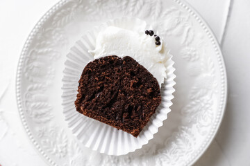 chocolate cake with chocolate muffin cupcake with butter cream and syrup and whipped cream