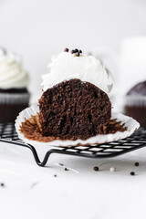 chocolate cake with chocolate muffin cupcake with butter cream and syrup and whipped cream