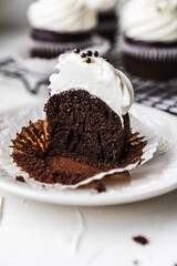 chocolate cake with chocolate muffin cupcake with butter cream and syrup and whipped cream