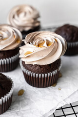 chocolate cake with chocolate muffin cupcake with butter cream and syrup and whipped cream