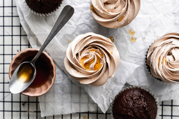 chocolate cake with chocolate muffin cupcake with butter cream and syrup and whipped cream