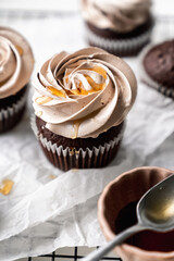 chocolate cake with chocolate muffin cupcake with butter cream and syrup and whipped cream
