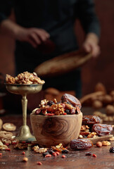 Various dried fruits and nuts on a kitchen table.