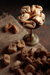 Dried figs in an old brass dish.