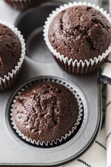 chocolate cake with chocolate muffin cupcake with butter cream and syrup and whipped cream