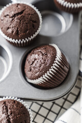 chocolate cake with chocolate muffin cupcake with butter cream and syrup and whipped cream