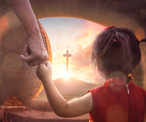 Easter concept: Child's hand holding mother's finger on blurred The cross of jesus christ background. - obrazy, fototapety, plakaty