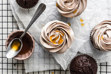 chocolate cake with chocolate muffin cupcake with butter cream and syrup and whipped cream