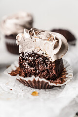 chocolate cake with chocolate muffin cupcake with butter cream and syrup and whipped cream