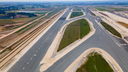 Aerial drone view of the runway at the construction site of the new International Airport at...