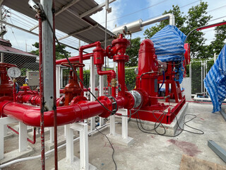 Red fire hydrant, pipe fire pump system in the factory.
